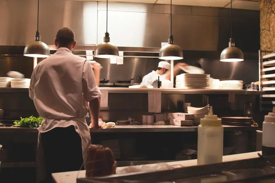 A chef at work in a busy kitchen